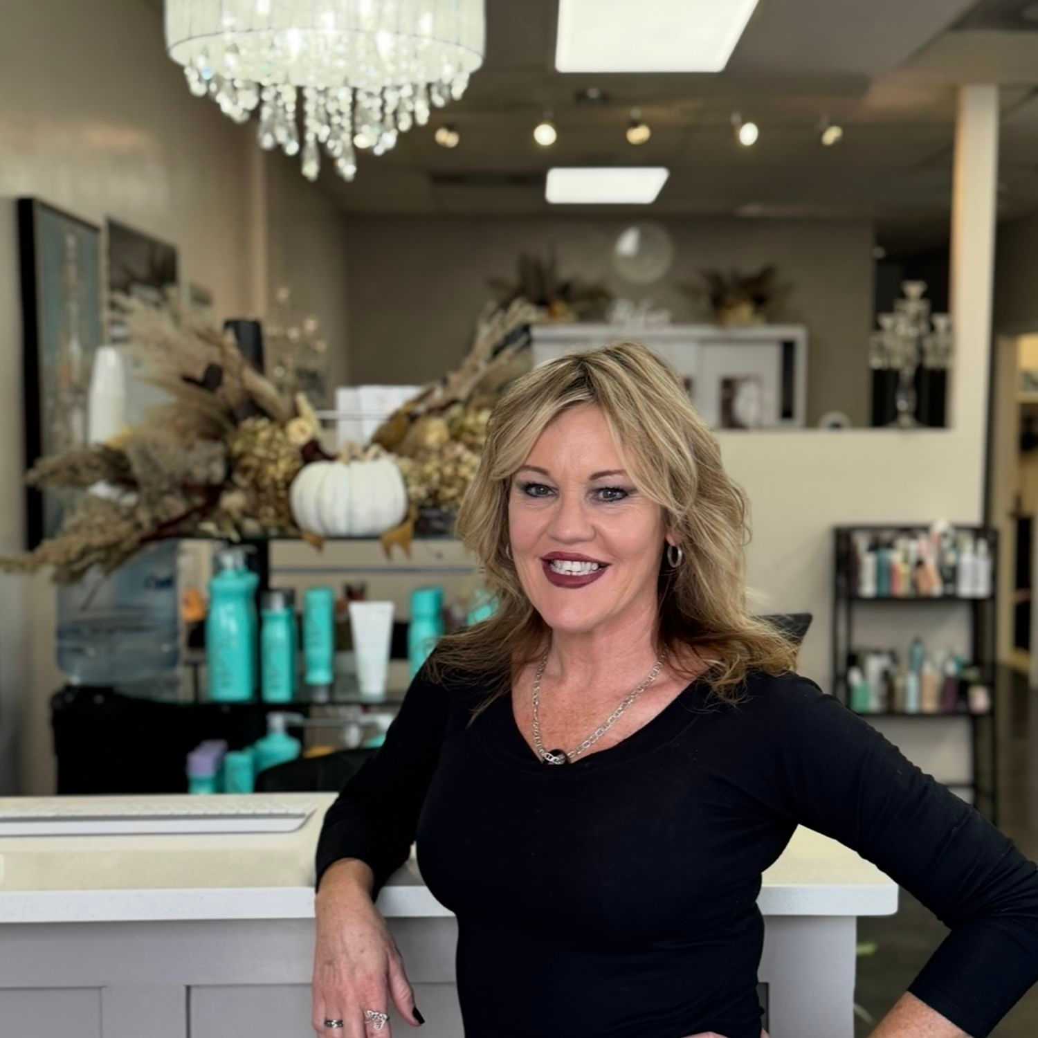 Portrait of Priscilla Chandler, a professional stylist at Glitter Hair Salon, showcasing their expertise and style.