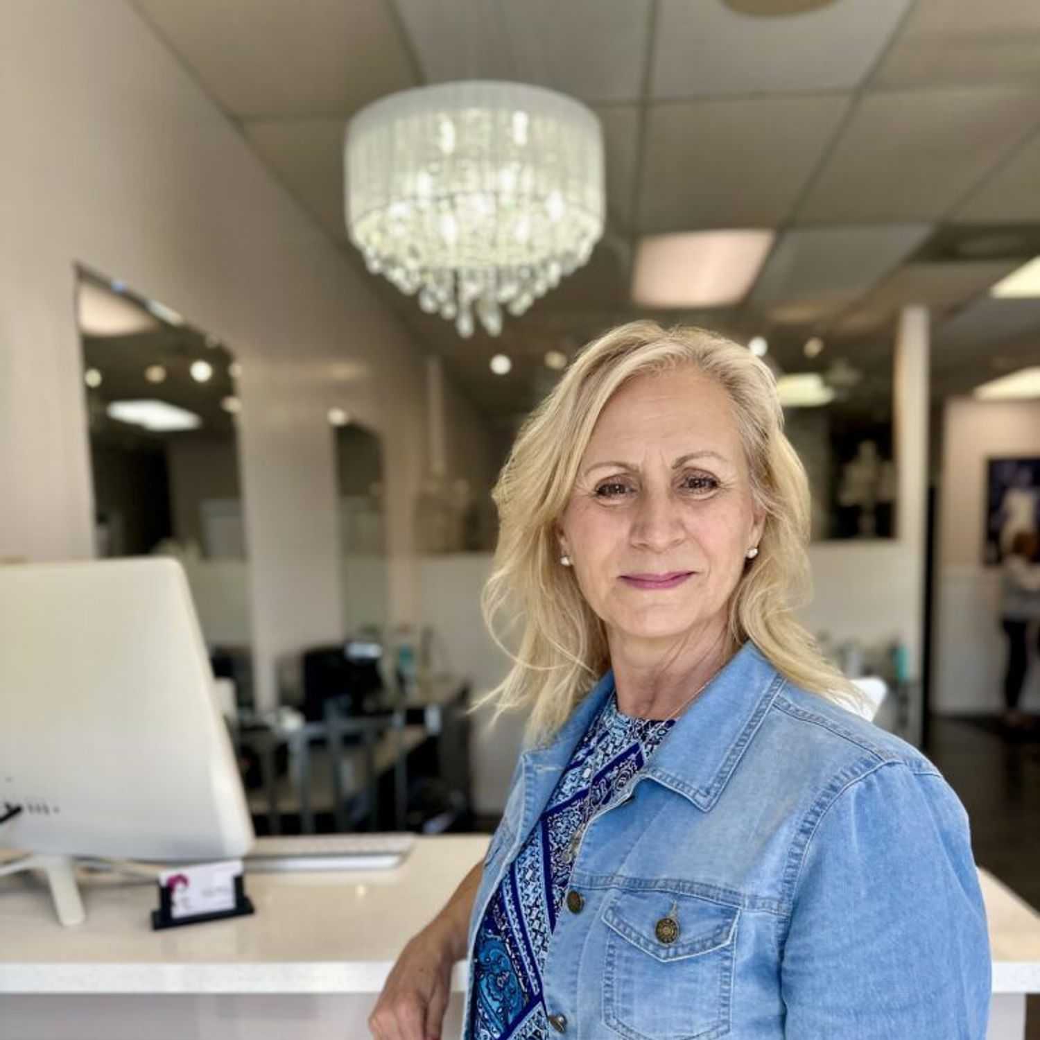 Portrait of Donna Ducharme, a professional stylist at Glitter Hair Salon, showcasing their expertise and style.